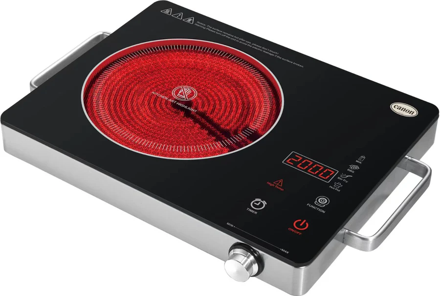 The black and silver CHA-CCT1-01-2.webp Electric Infrared Hob has a glowing red single burner, digital display showing 2000, control buttons, side handles, and the Canon brand name at the top right.
