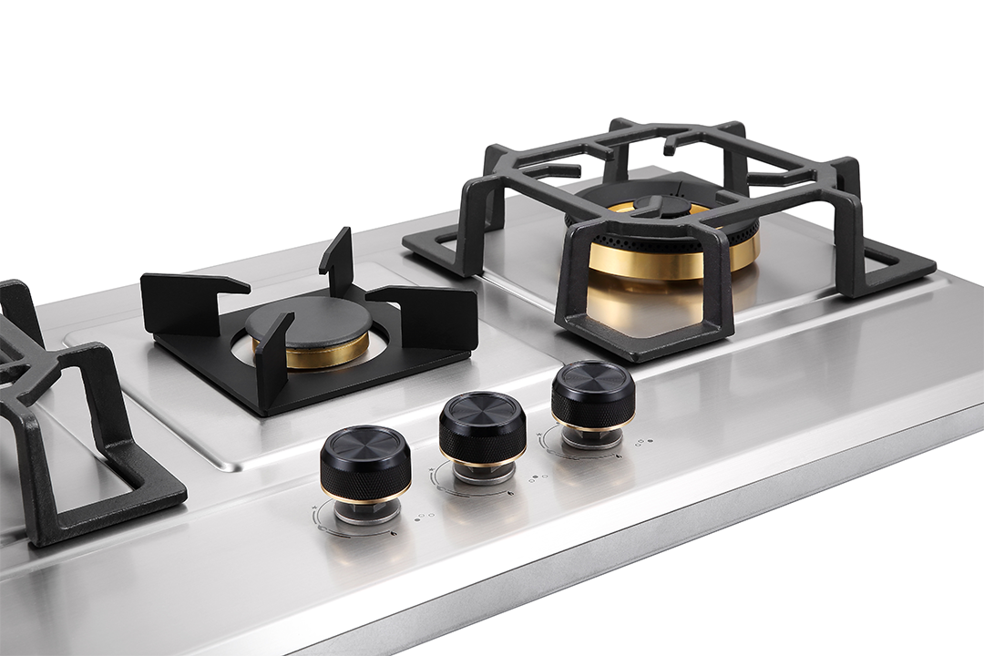 A close-up of the FBH-SS86-3CB-02, a modern 3-burner stainless steel kitchen hob featuring three black control knobs and sturdy black pan supports over each burner.